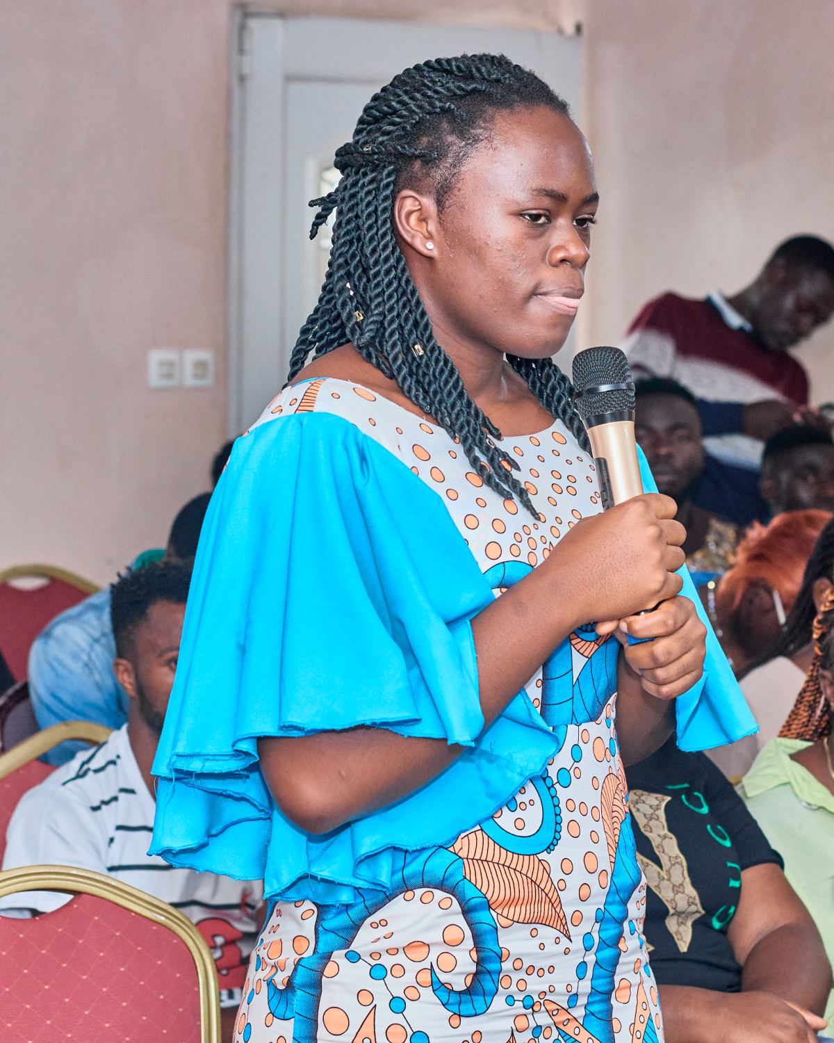 A young woman asking a question from the audience