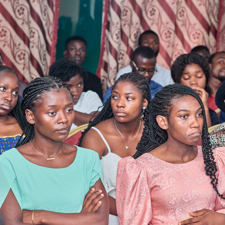 Young women listening during a panel discussion