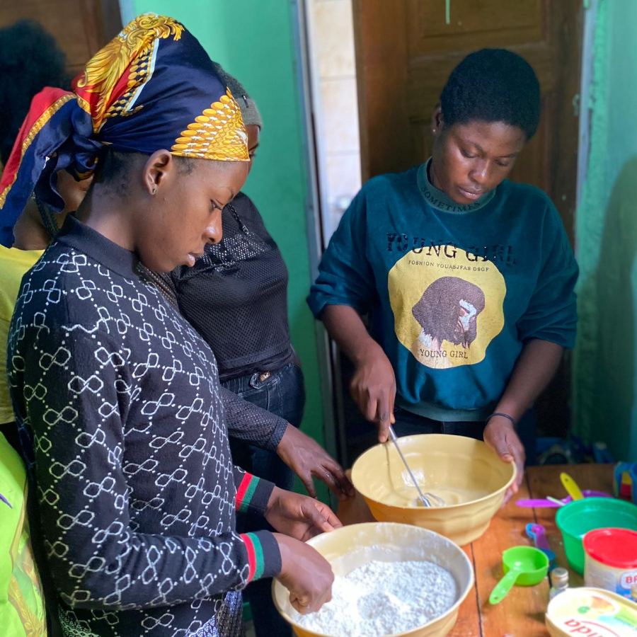 Trainees mixing dough during a pastry class